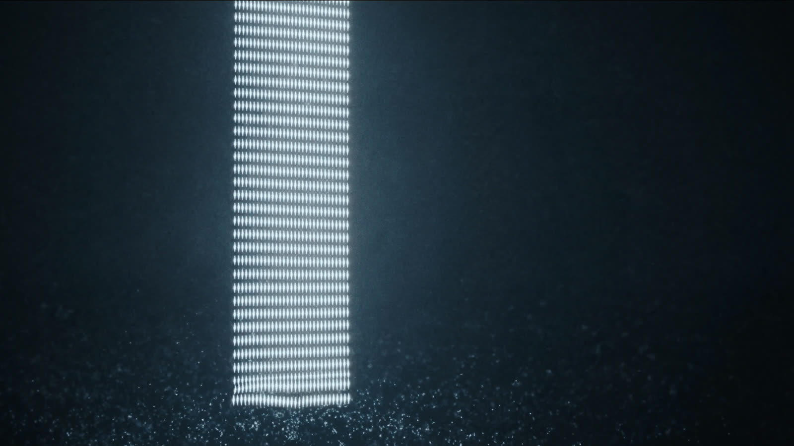Una columna de puntos de luz perfectamente alineados que nace de partículas sueltas.